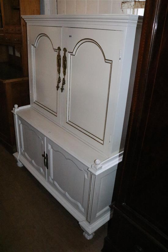 Large white and gilt painted cupboard on chest